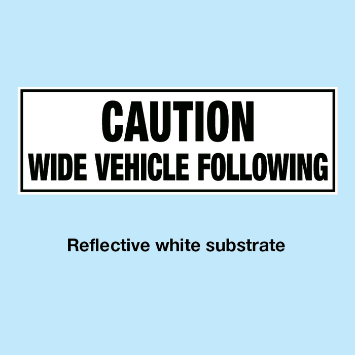 CAUTION WIDE VEHICLE FOLLOWING